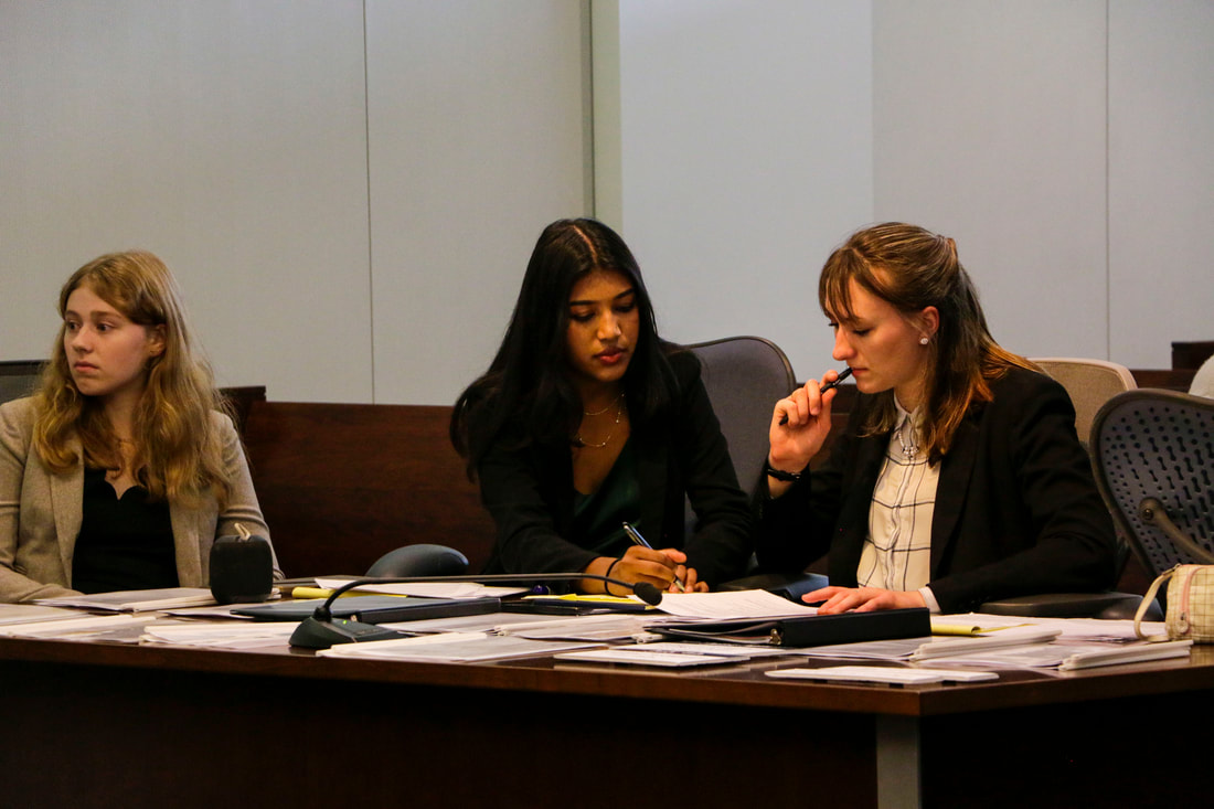 Attorneys at the counsel table during a trial